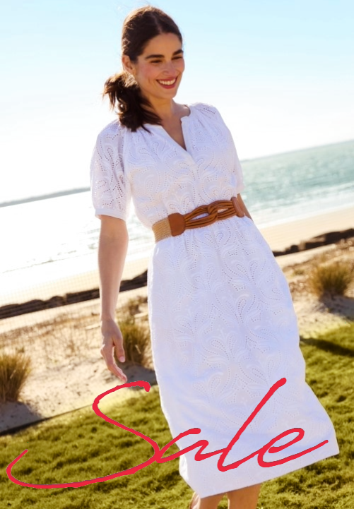 black and white image of woman in striped shirt with red cursive sale headline overlayed