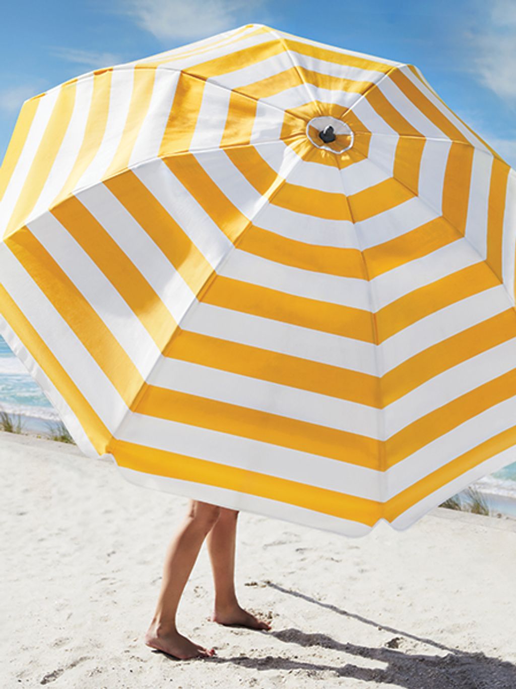 Striped umbrella on beach