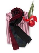 laydown of mens red and white striped shirt with ties and red christmas ornament
