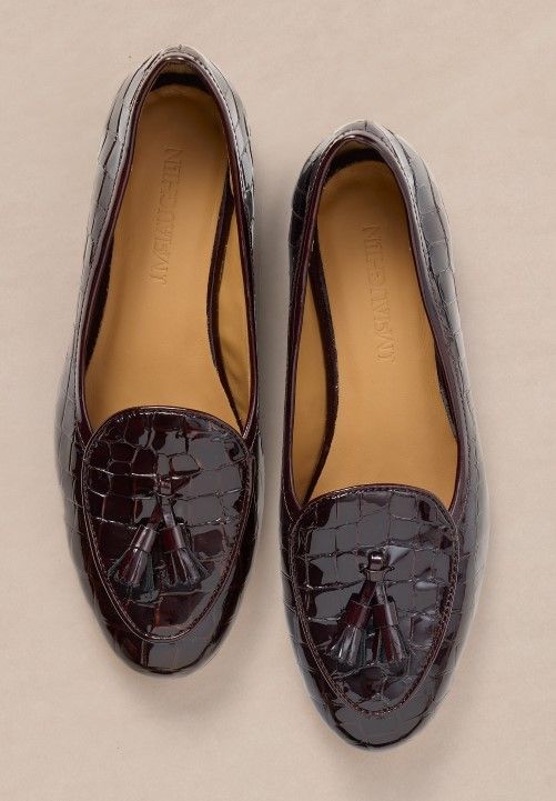 womens embossed croc loafer in patent leather on light brown studio background