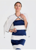 A woman wears a navy and white striped strapless dress with a white cropped jacket trimmed in navy.