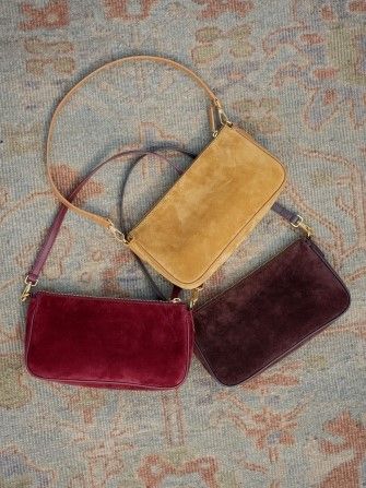 group of suede bags on carpet