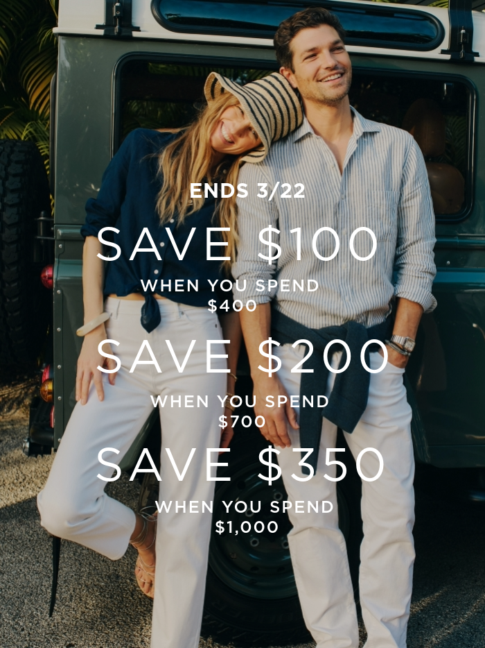 woman and man standing outside in front of jeep wearing navy and white denim with linen shirts