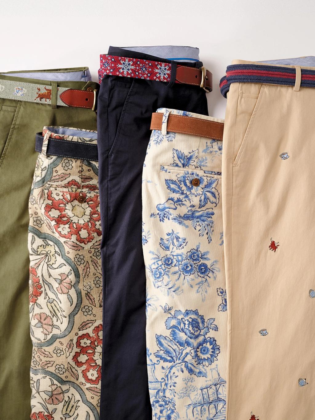 Five pairs of men's pants in various solid colors and patterns, each with a unique belt.