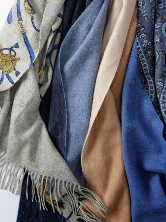 group of womens cashmere scarves in various colors and patterns