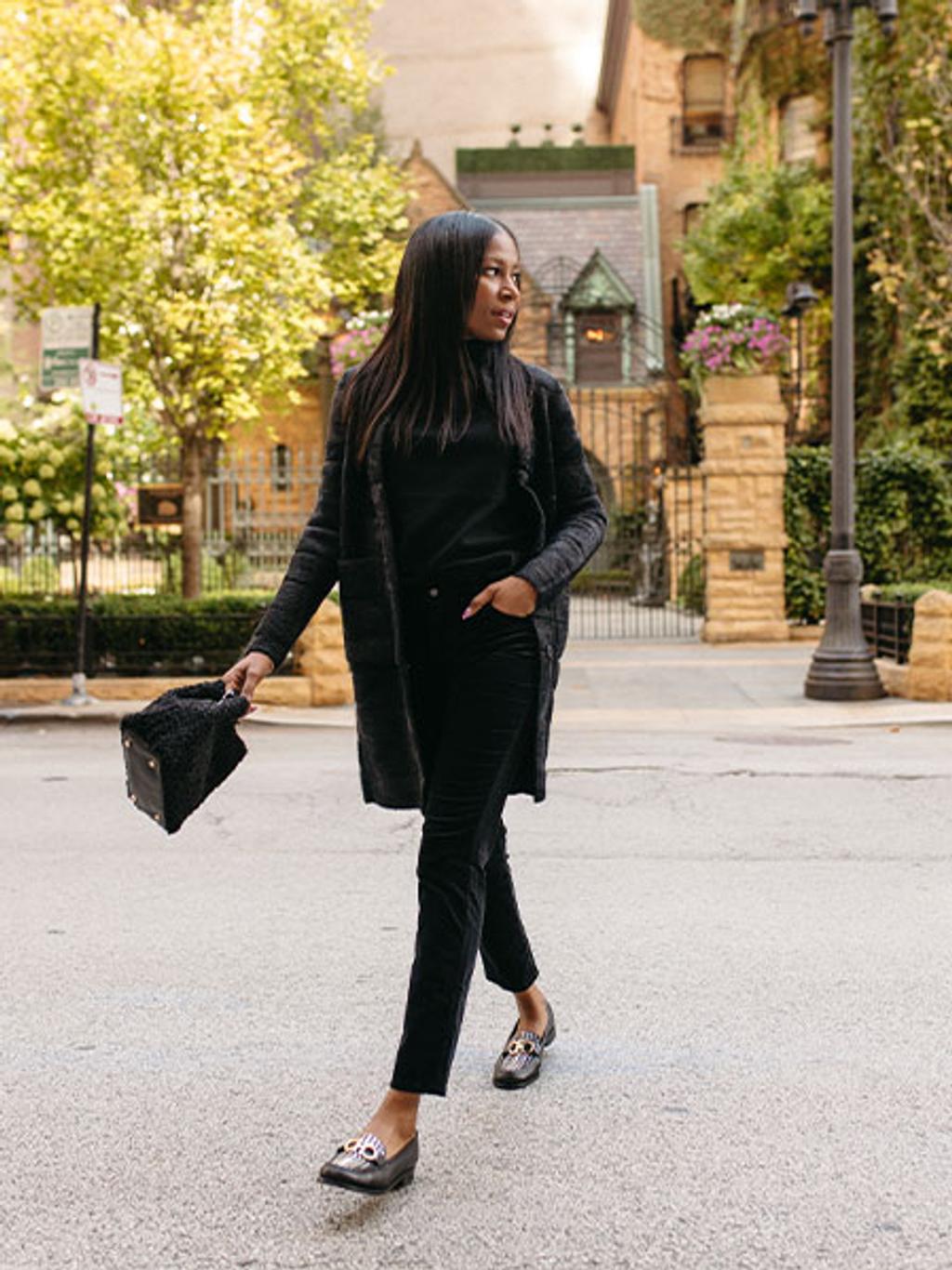 Model wearing Tripp cardi-coat in black, black turtleneck, and black velveteen jeans 