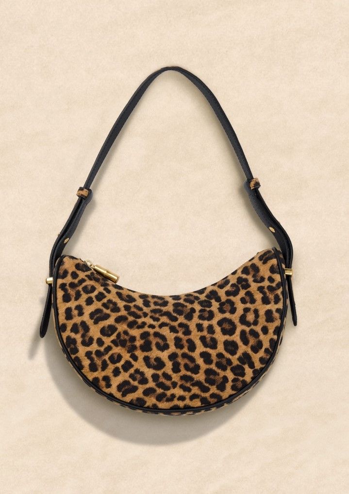 STILL LIFE OF WOMENS LEOPARD SHOULDER BAG