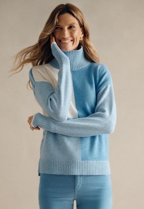 woman wearing powder blue colorblock cashmere turtleneck sweater.