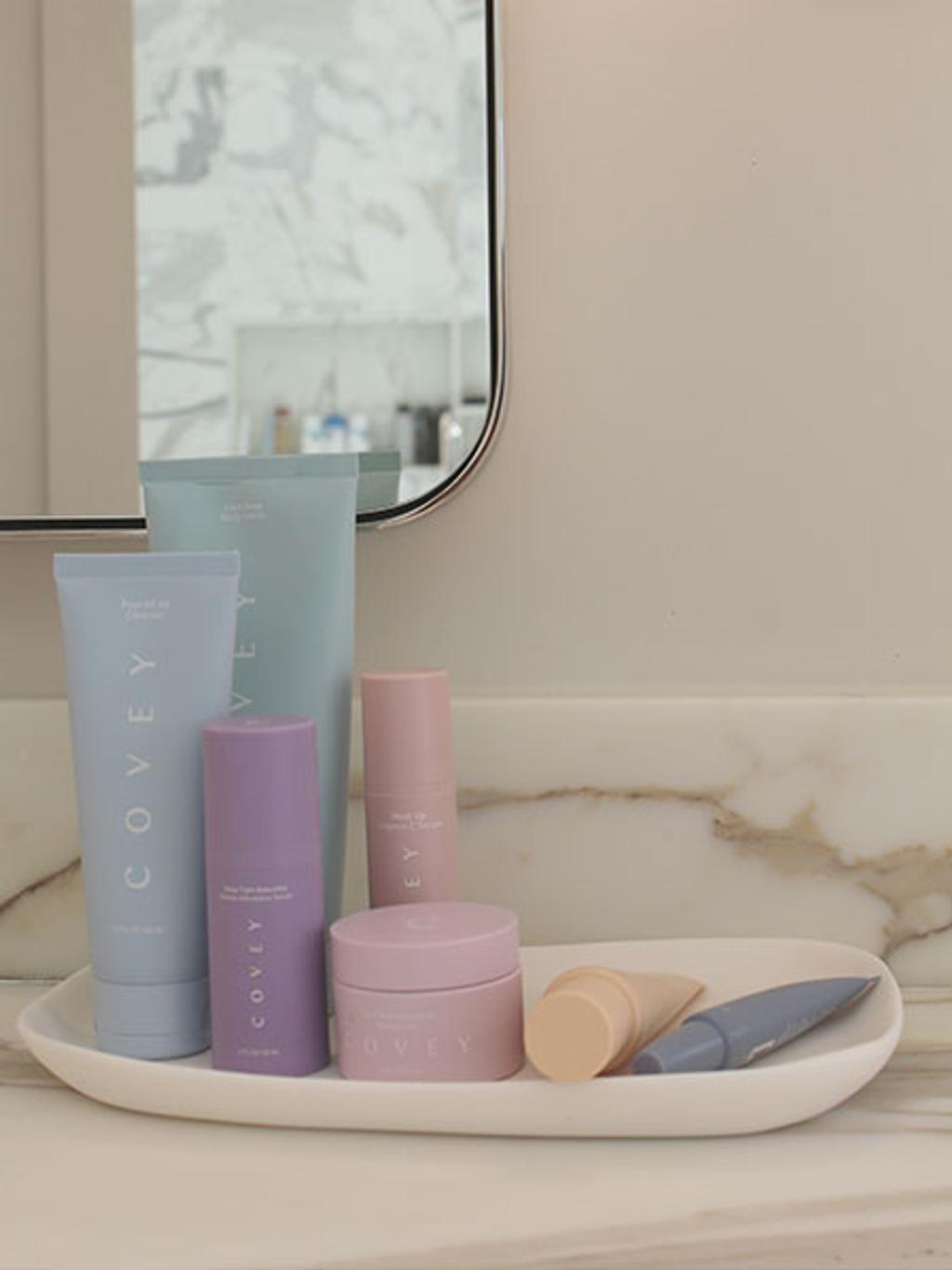 Covey skincare products on marble countertop Covey skincare products on marble countertop