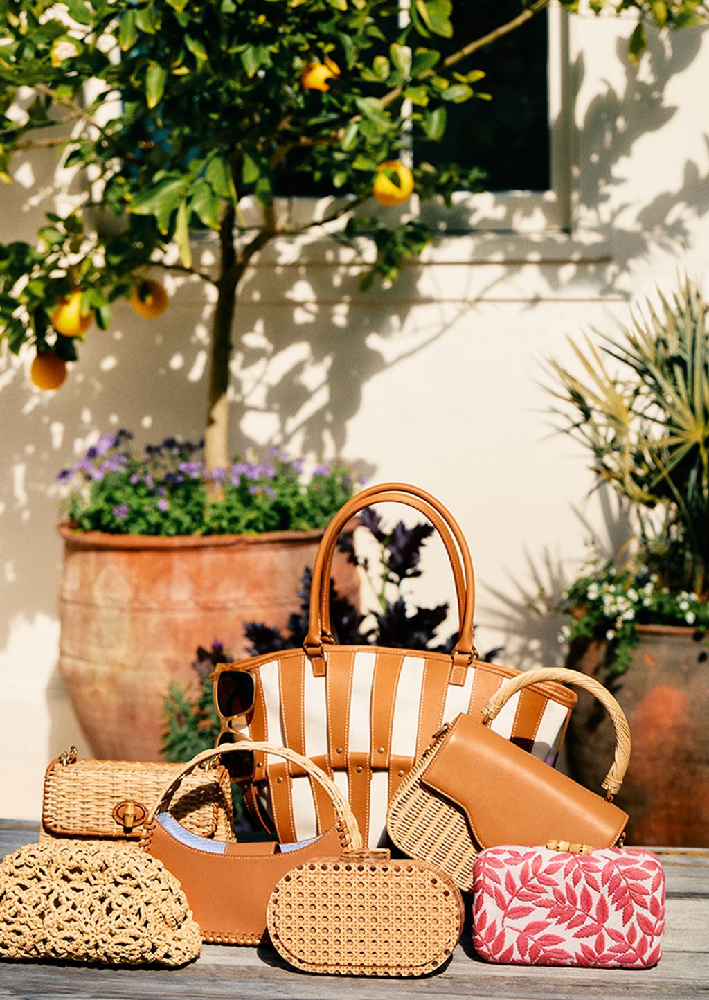 spring handbags displayed on wooden table