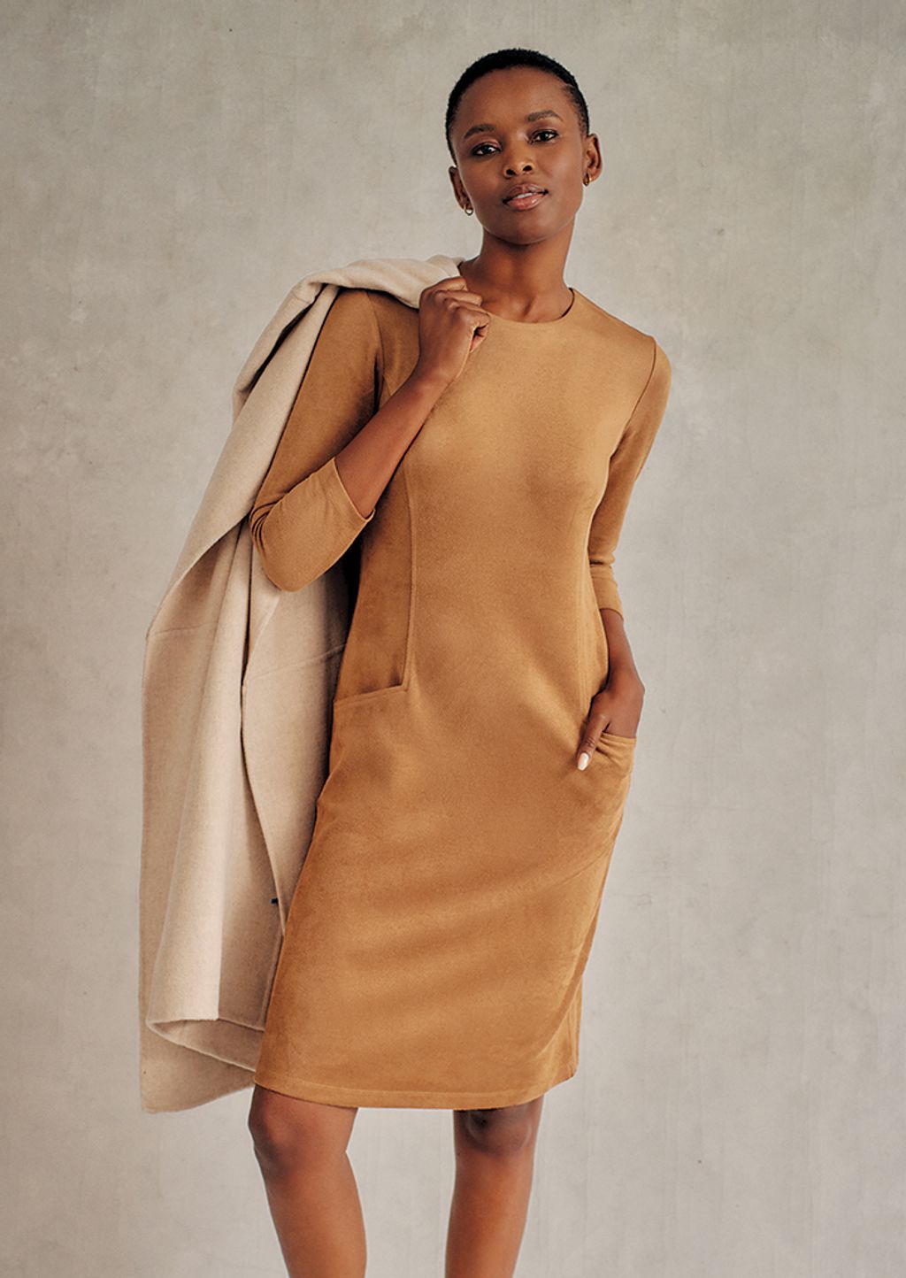 Woman in tan suede dress.