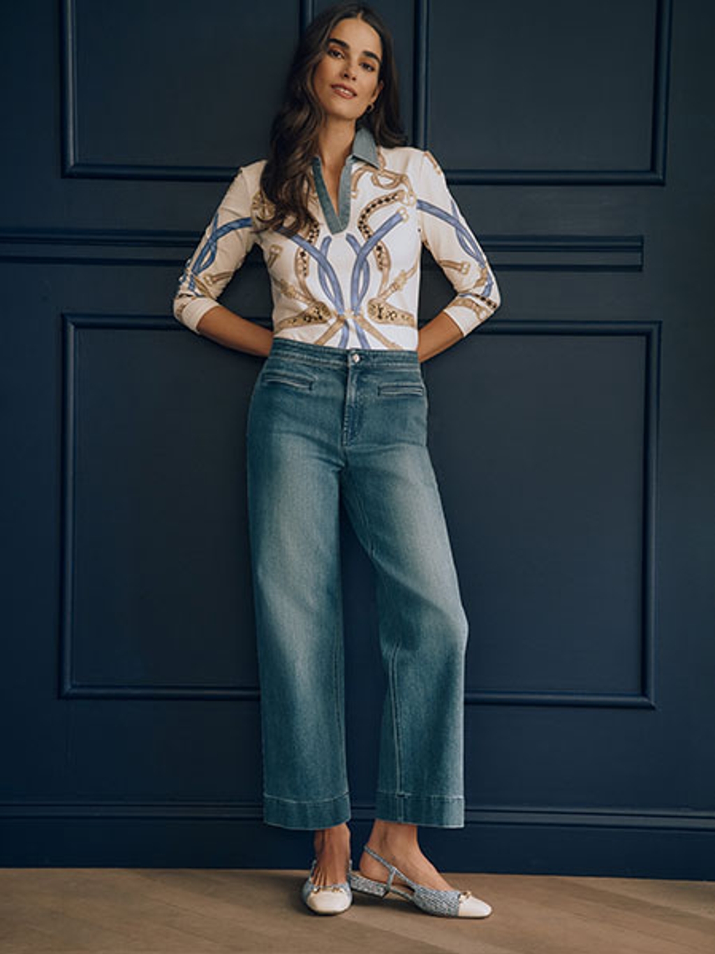 Model in heraldic-print top with wide-leg jeans Model in heraldic-print top with wide-leg jeans