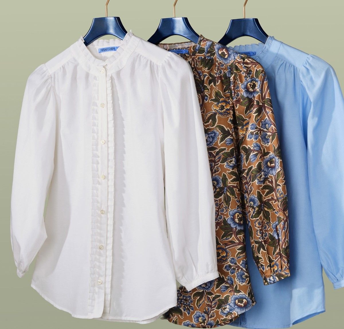 group of womens puff sleeve blouses hanging on a rack