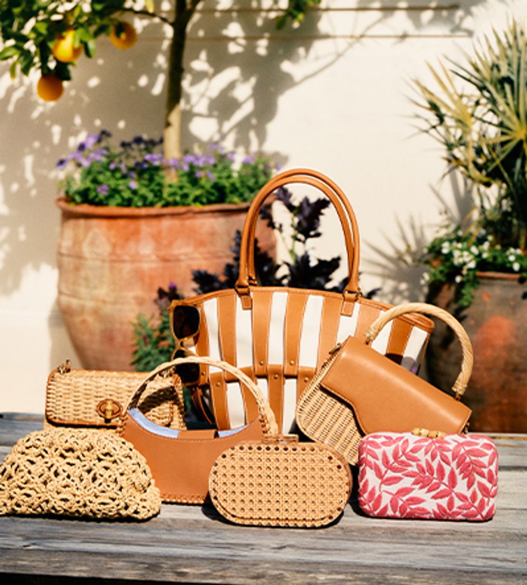 spring handbags displayed on wooden table