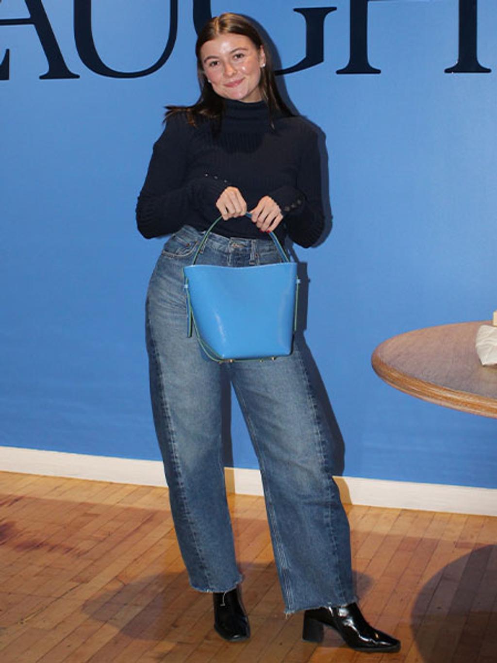 Lilly with a blue bucket bag