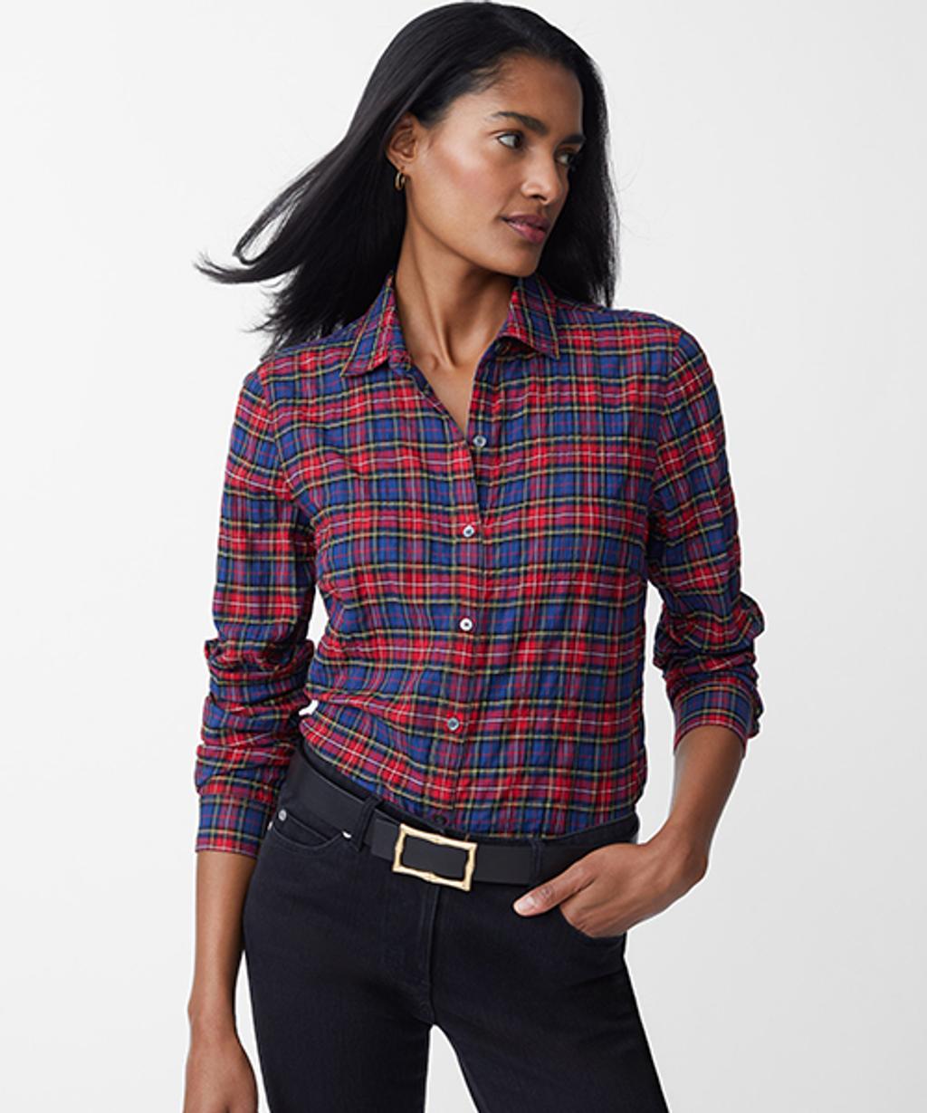 Model wearing tartan button-down, slim fit jeans, and reversible leather belt.