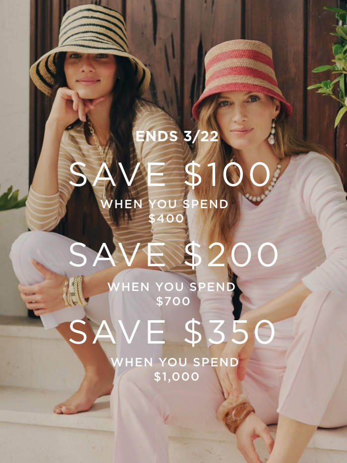 two women seated outside on front steps wearing striped boatneck tees