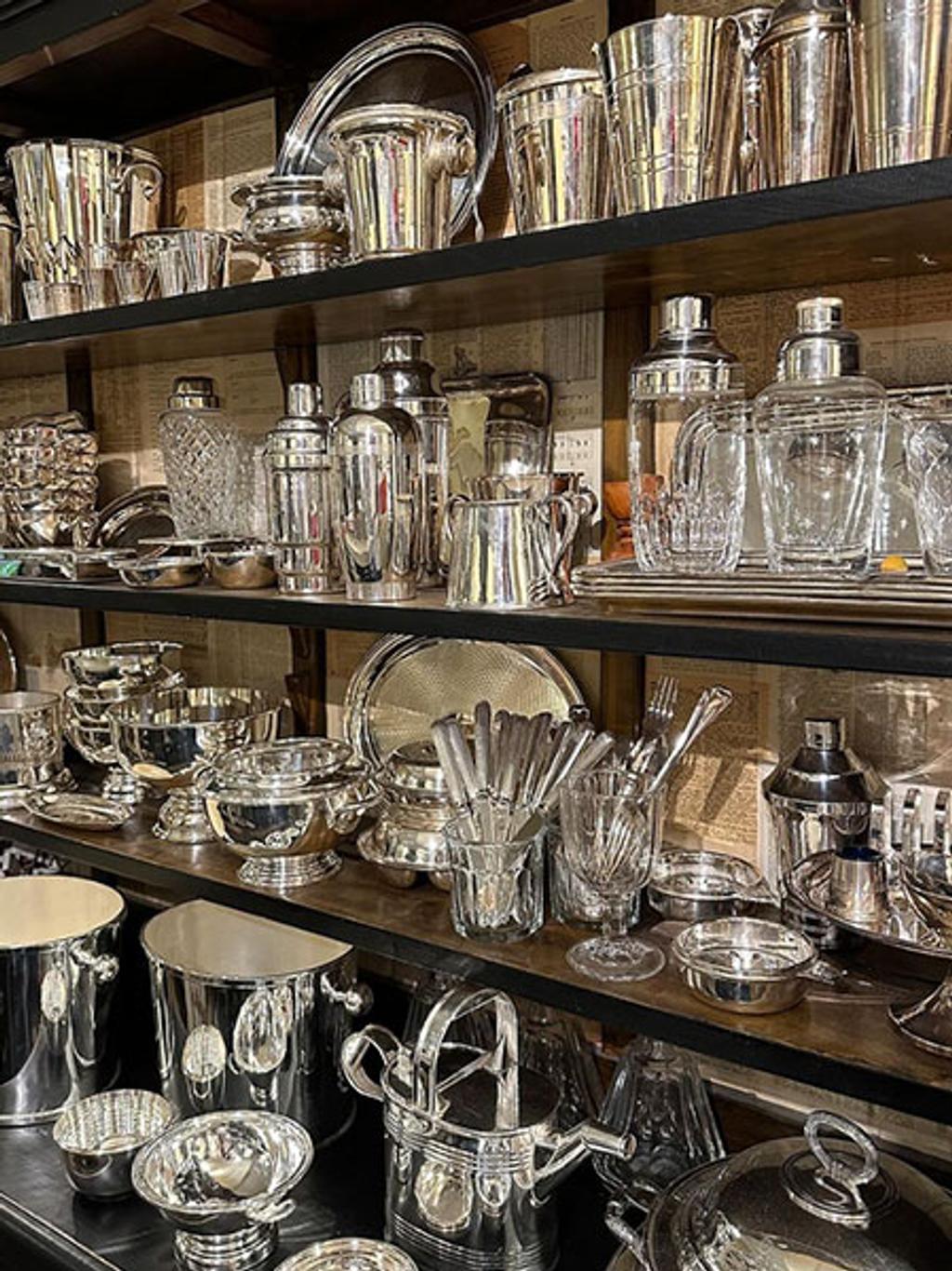 Rows of vintage hotel silver