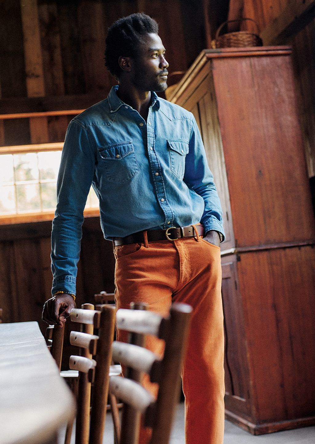 Male model wearing chambray shirt and 5 pocket corduroy pant