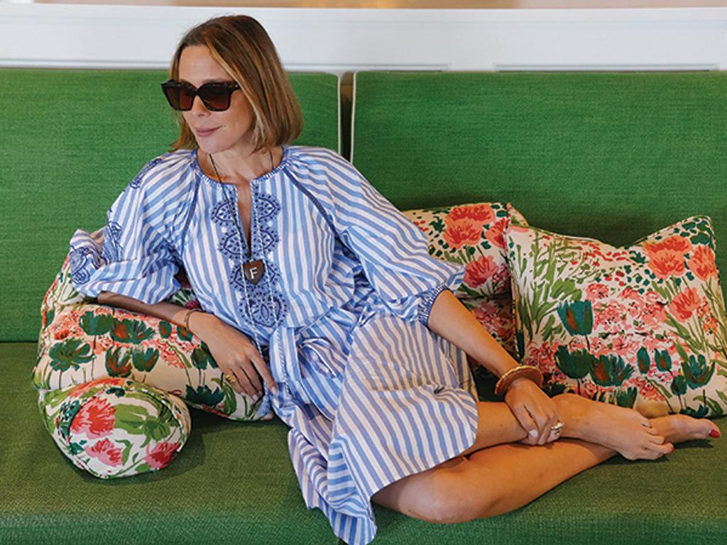 Filipa de Abreu in striped dress on green couch