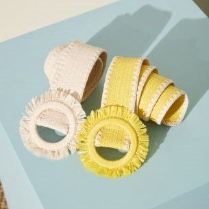duo of white and yellow grasscloth belts on light blue background