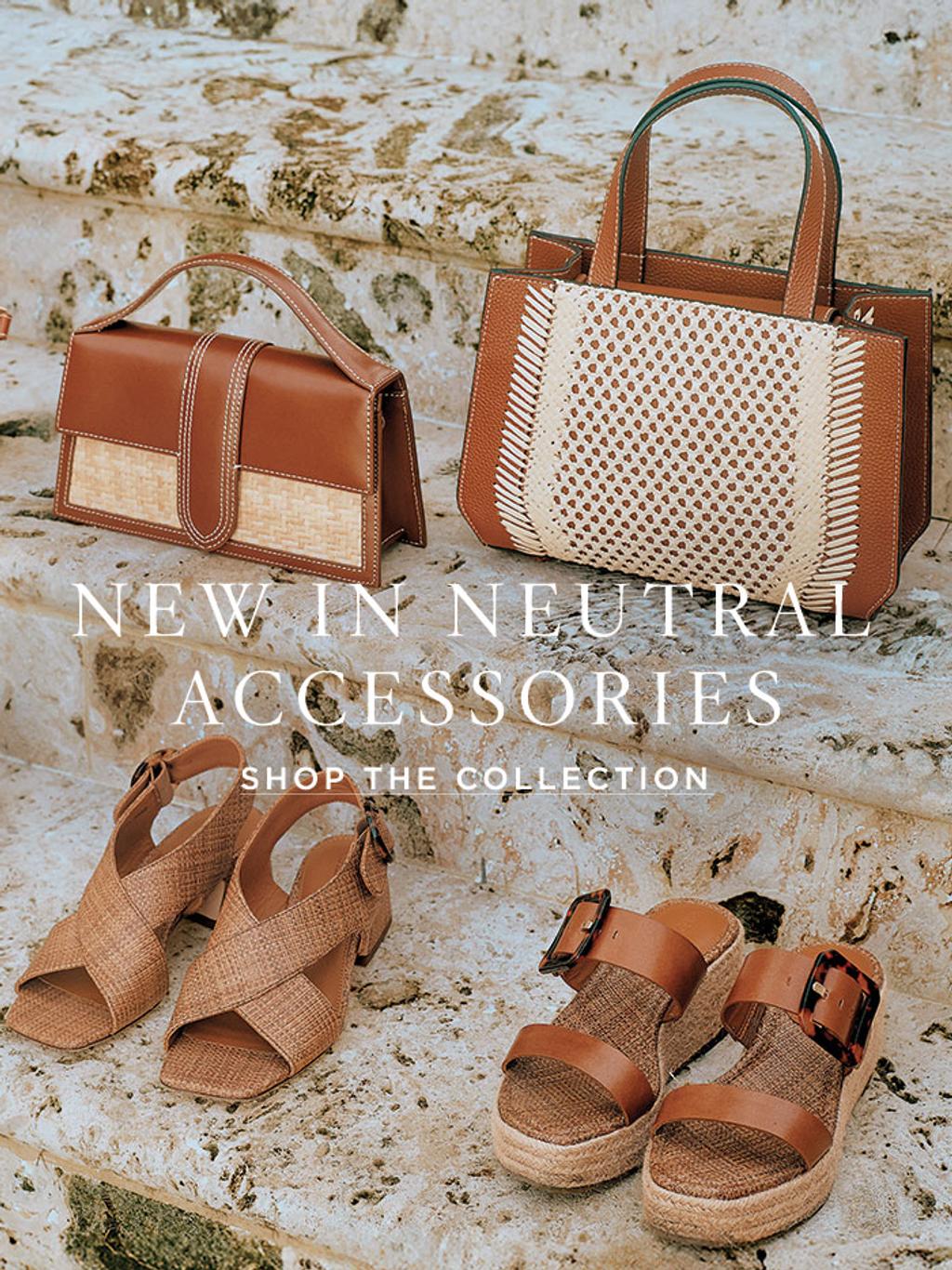 laydown of womens neutral sandals and handbags in vacetta leather and textures of wicker, rattan and straw, positioned atop stone stairs outside