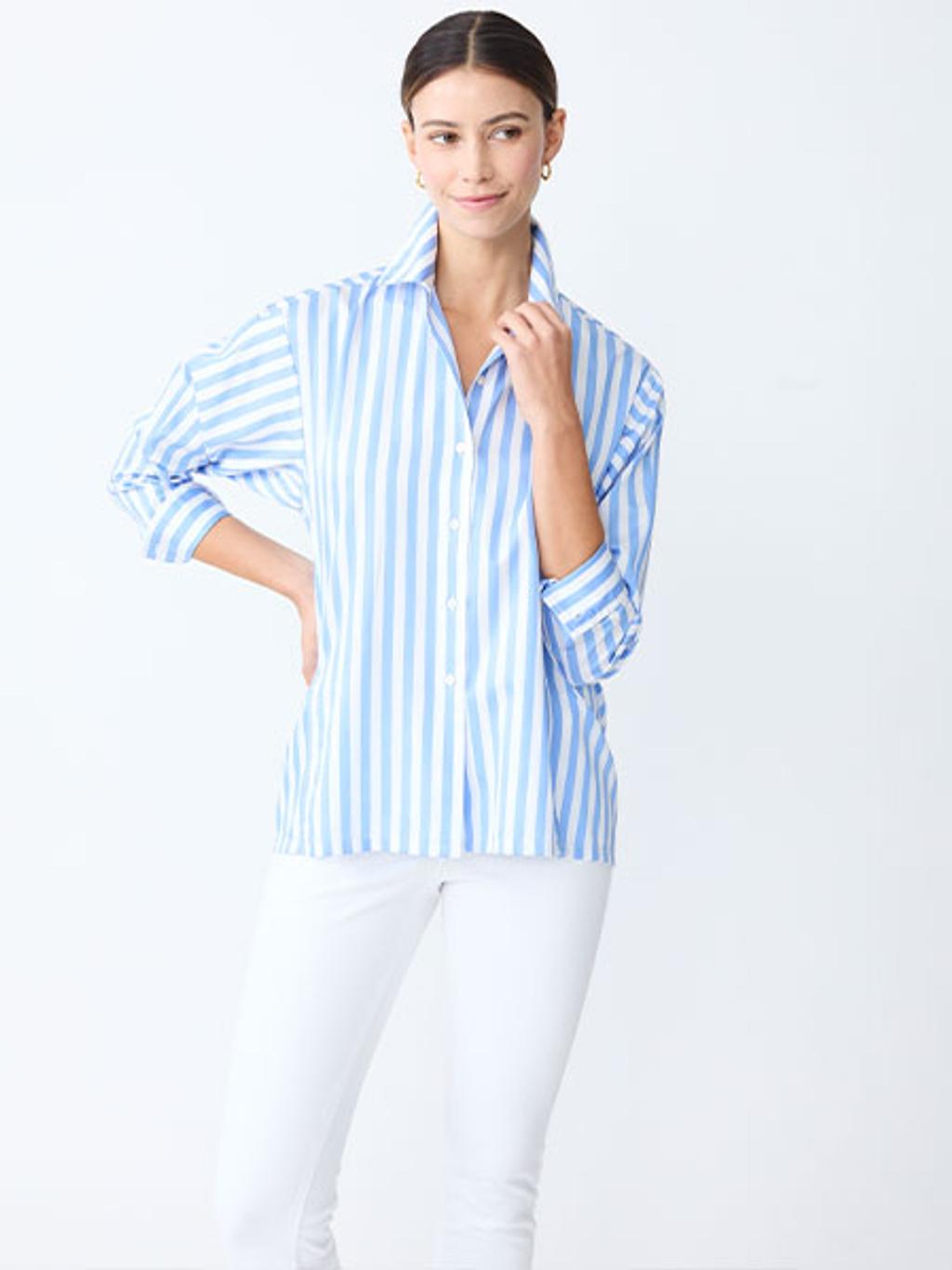 Model in blue striped shirt and white pants Model in blue striped shirt and white pants