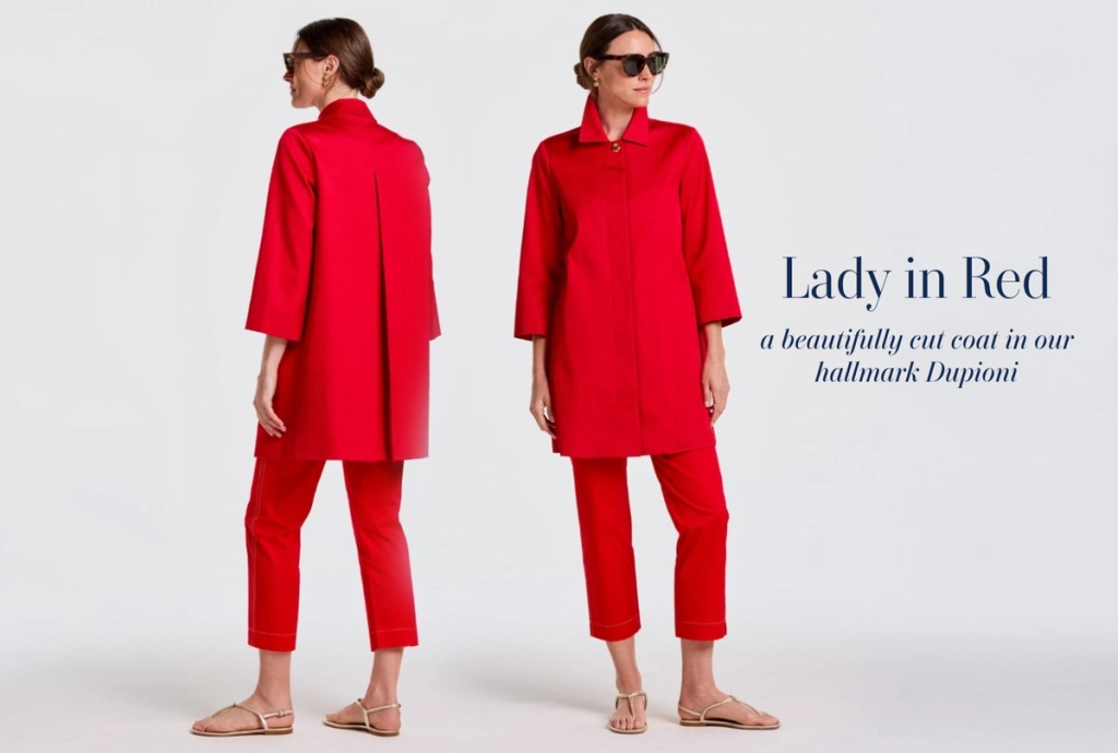 A woman models a red coat and matching pants in front and back views. Text reads: "LADY in RED a beautifully cut coat in our hallmark Dupioni."