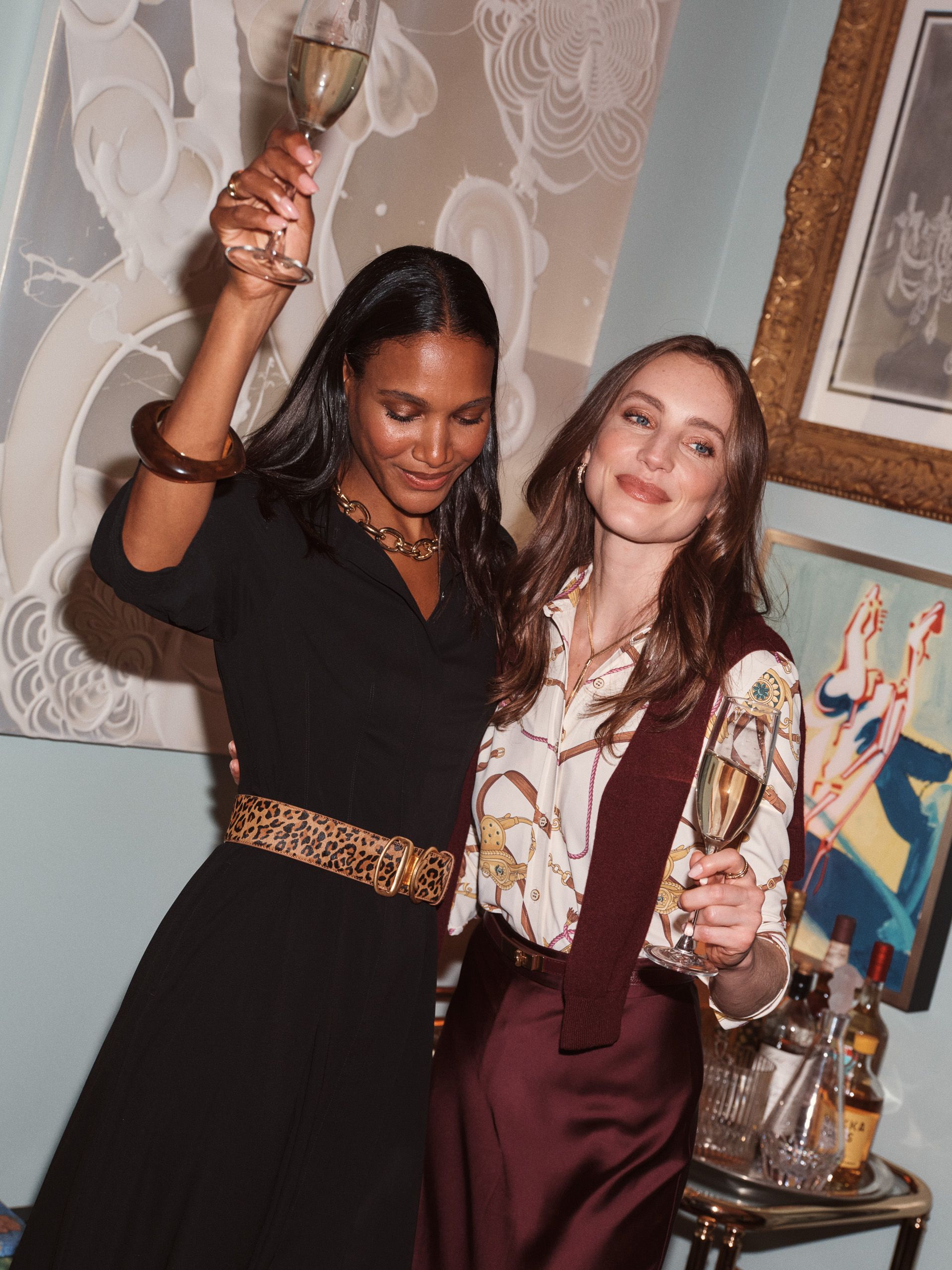 Models toasting at dinner party