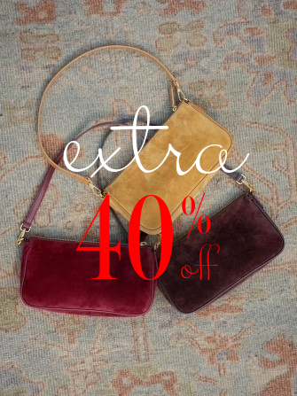 group of suede bags on carpet