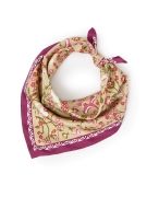 still life image of floral printed scarf tied in handkerchief neck style