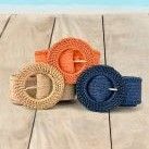 trio of orange, natural and navy grasscloth belts on pool deck