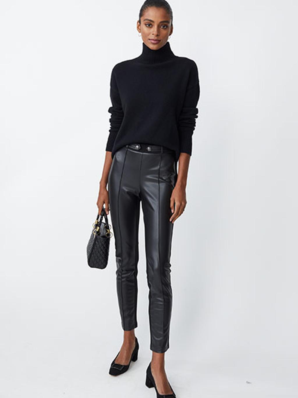 Model wearing turtleneck and faux-leather leggings Model wearing turtleneck and faux-leather leggings