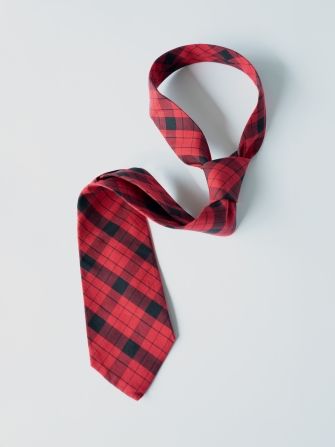 mens red tartan tie laydown but with shot with shape of mens neck