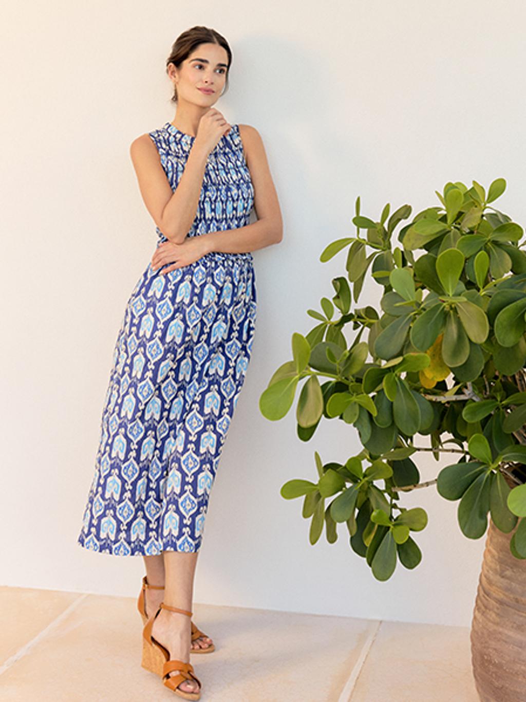 Woman in blue and white dress