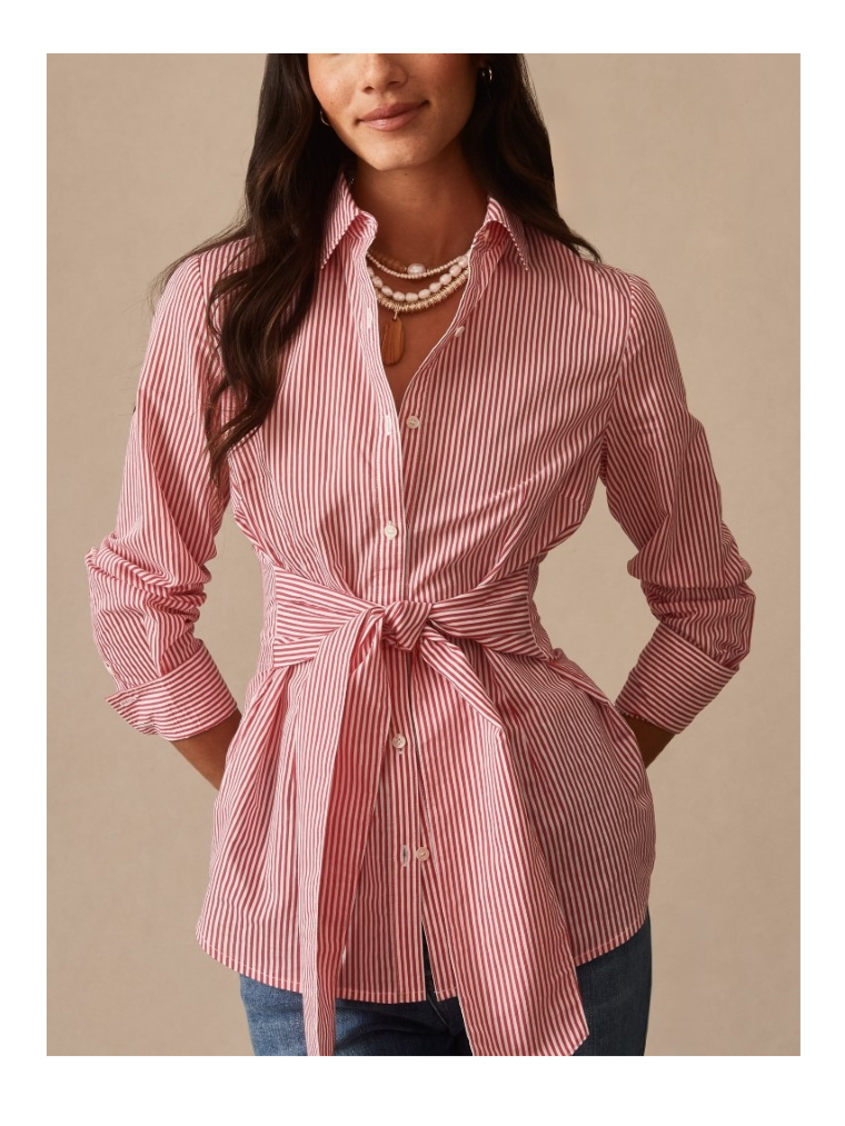 tight close up image of woman wearing pink and white stripe button down shirt with sash tie cinch waist