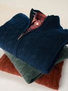 stack of men's cable cashmere zip cardigans