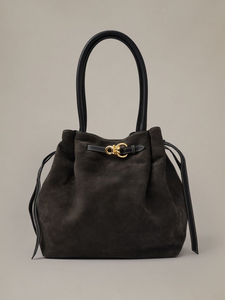 Dark gray suede bucket bag with black handles, a gold-tone clasp, and side drawstrings.