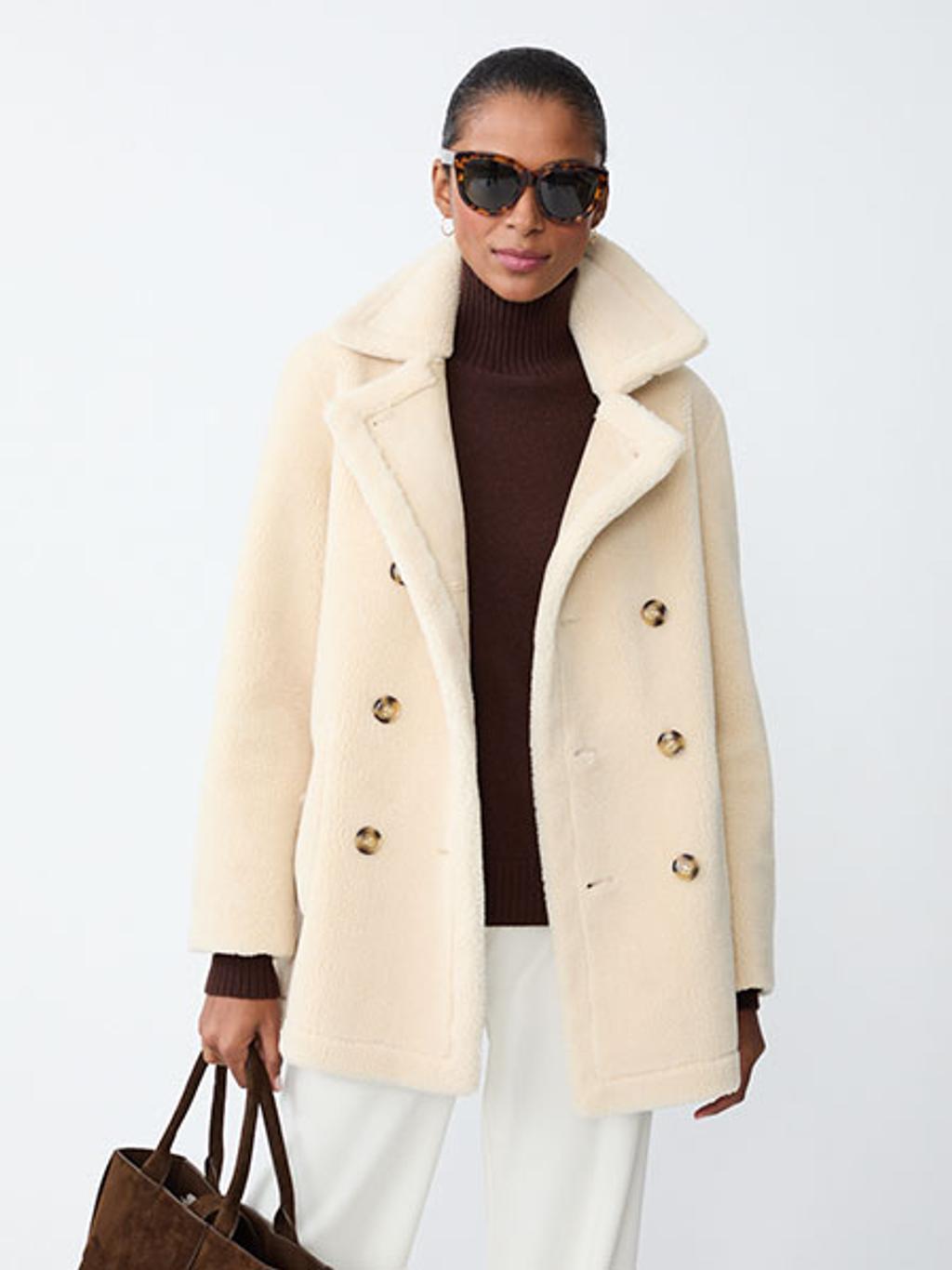 Model wearing reversible faux shearling jacket Model wearing reversible faux shearling jacket