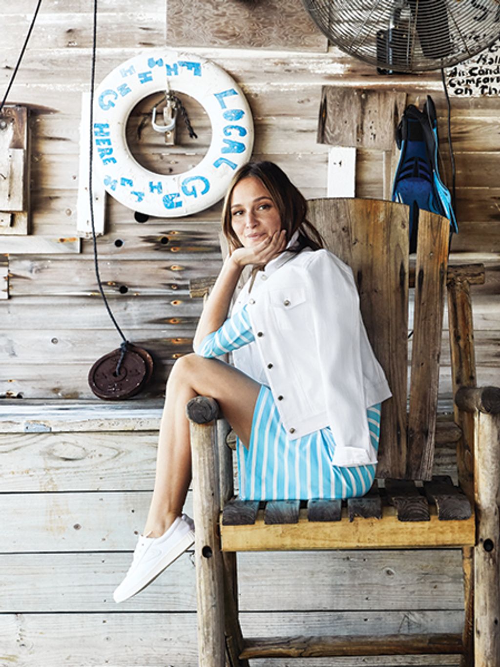 Model in striped dress on a dock