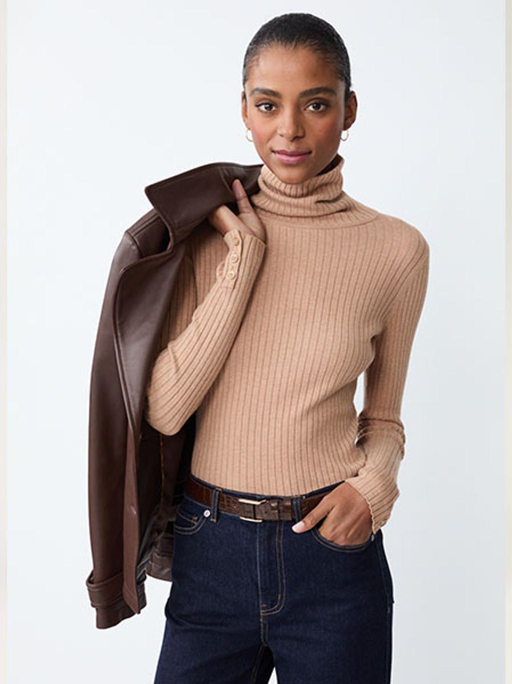 Model in camel turtleneck and jeans Model in camel turtleneck and jeans