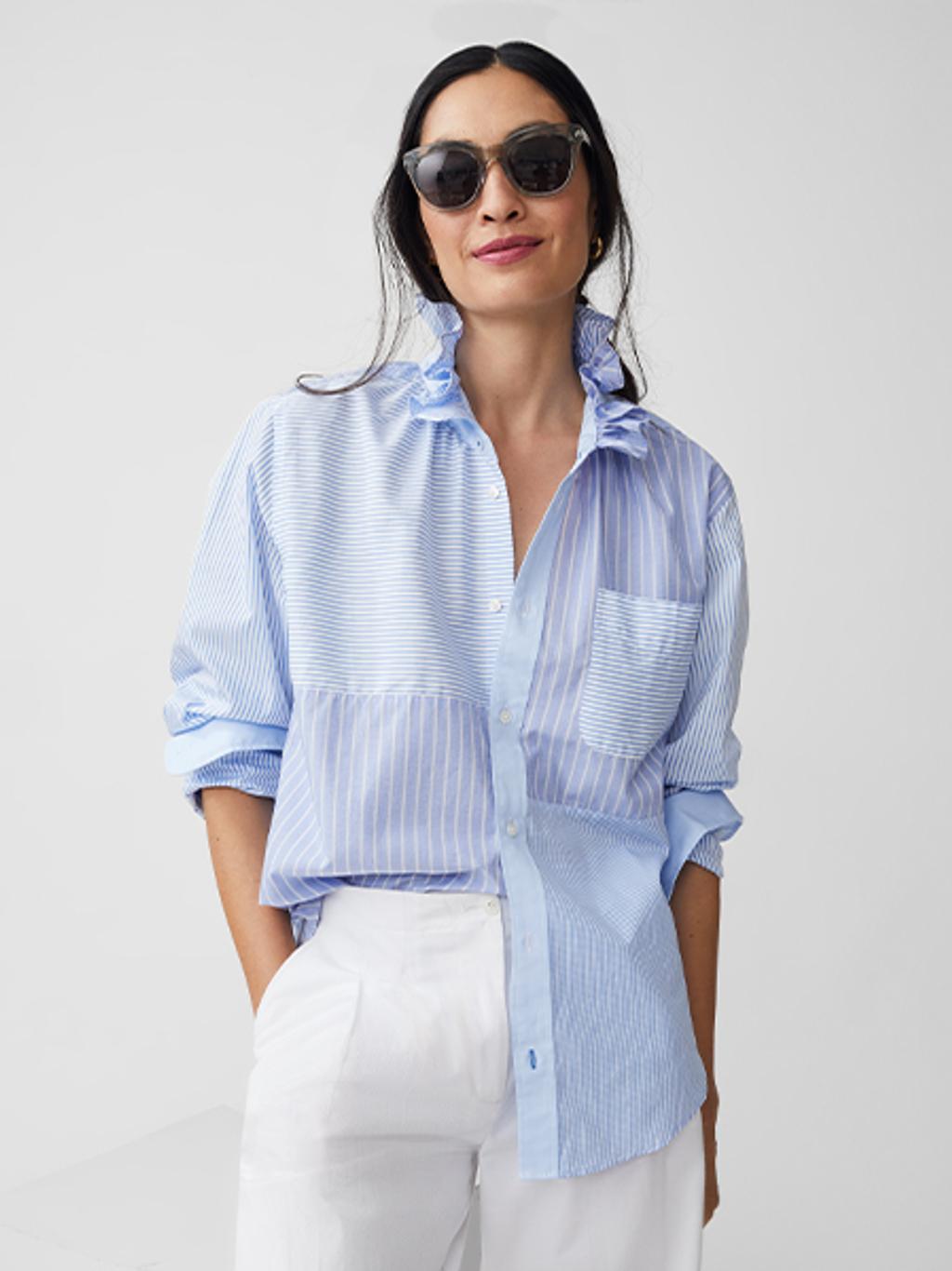 Model wearing limited-edition J.McLaughlin x KMJ shirt with white linen pants and tortoise sunglasses.