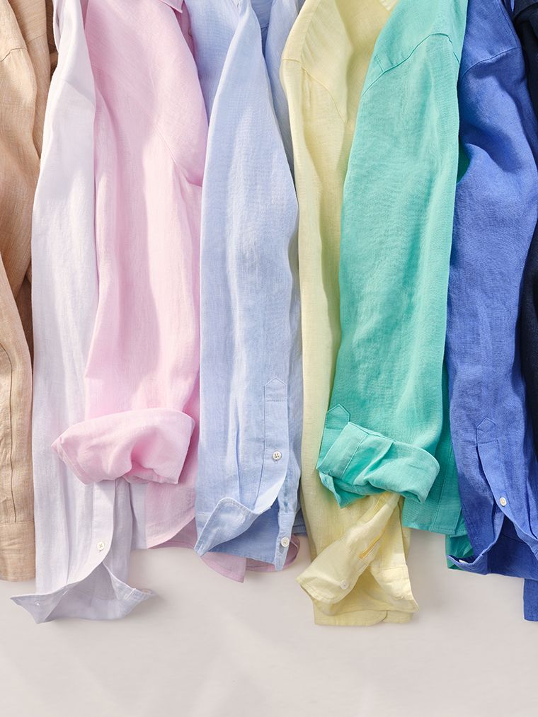 laydown image of colorful linen button down shirts 