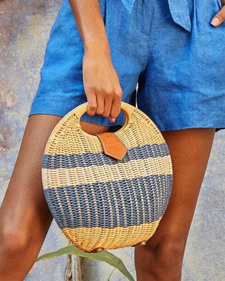 J.McLaughlin purchases clam shape wicker tote brown/blue