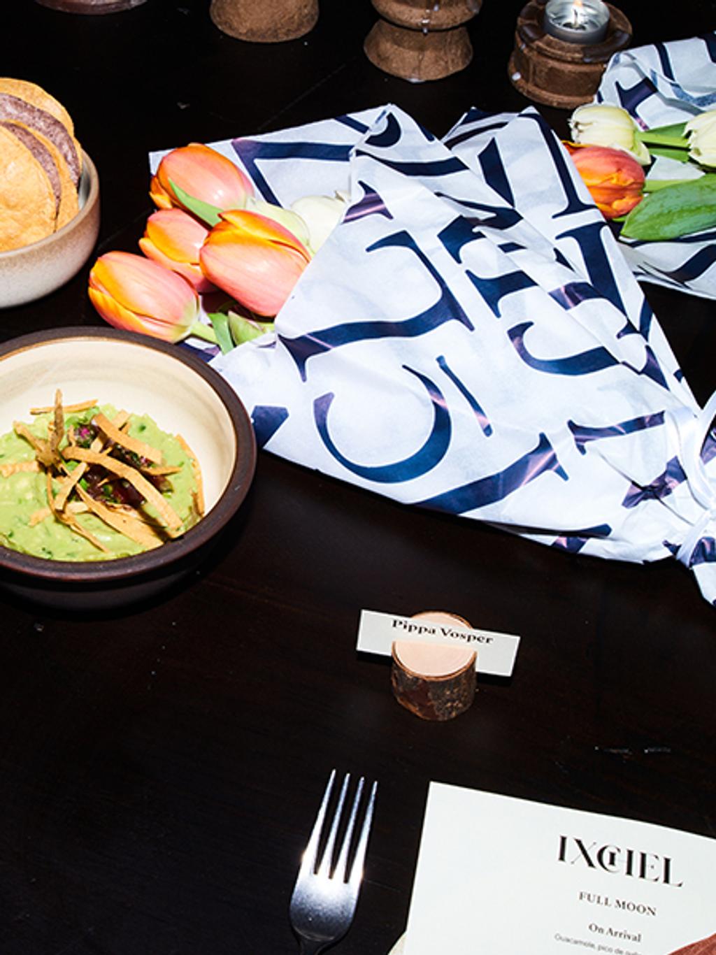 Flowers by Blooming Haus were wrapped in signature J.McLaughlin wrapping paper and set at each guests' seat.