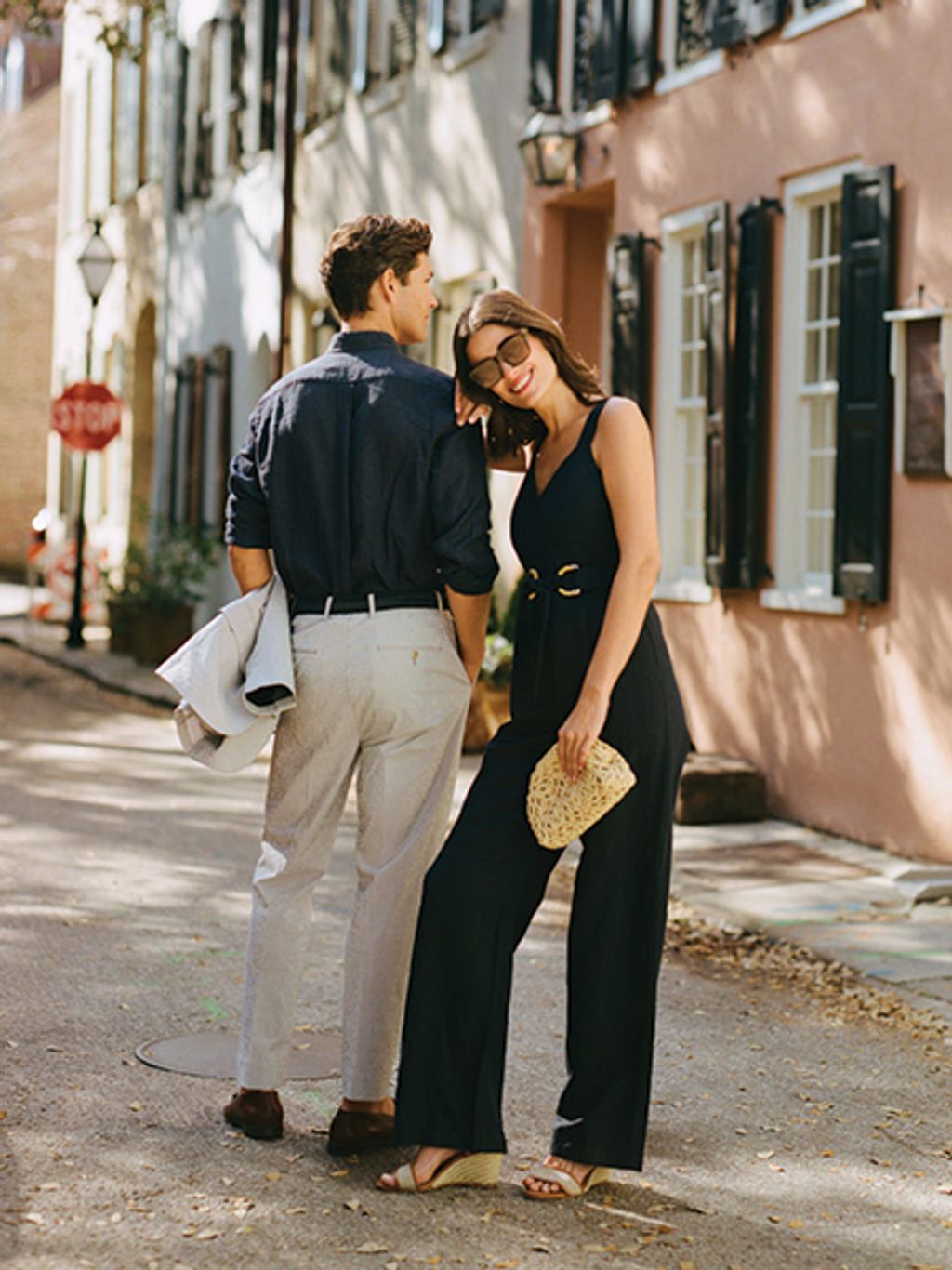 Male and female models, dressed up in Charleston. Female model holding crochet clutch.