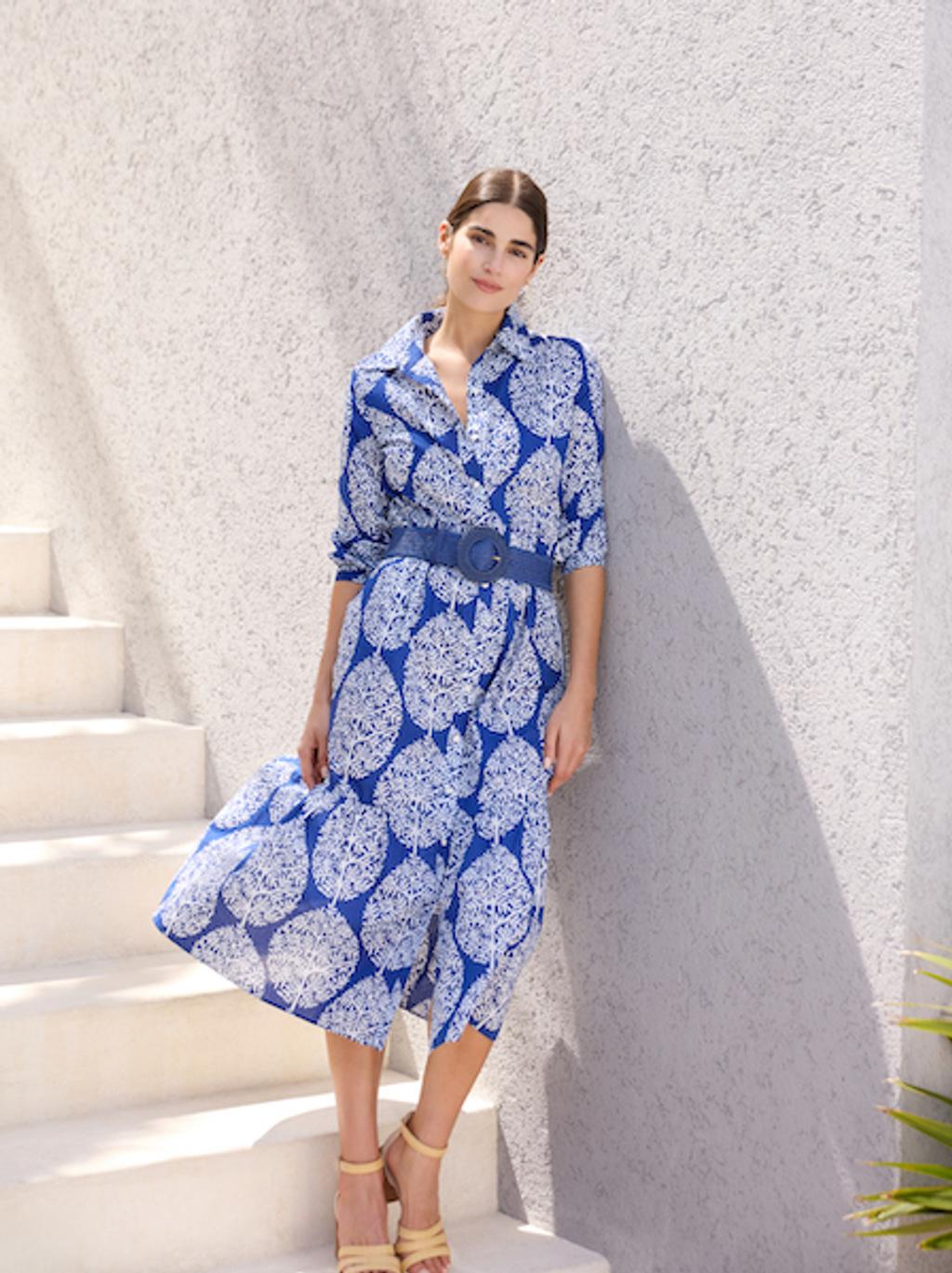 Woman in blue midi dress
