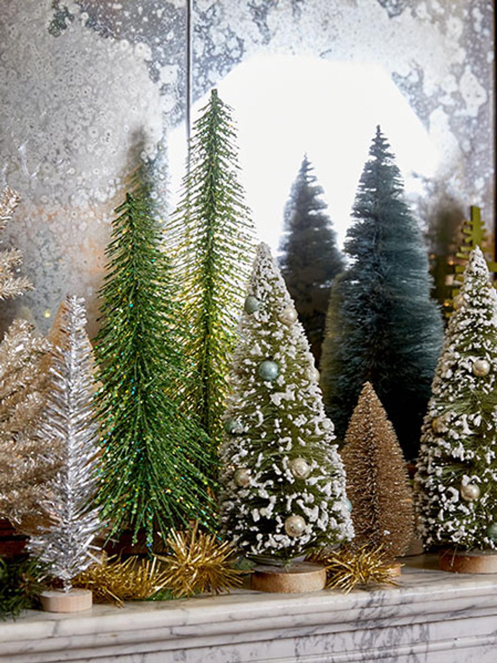Mantle with decorative mini Christmas trees Mantle with decorative mini Christmas trees