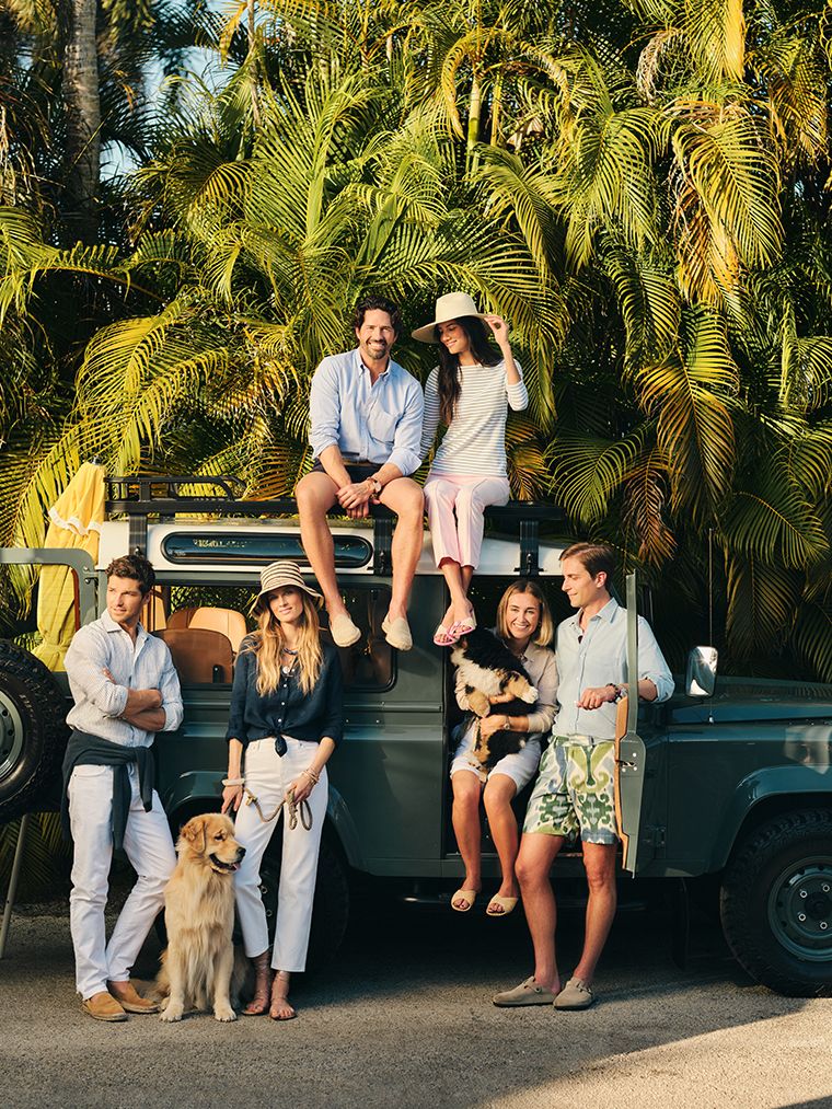 tight close up image of woman wearing pink and white stripe button down shirt with sash tie cinch waist