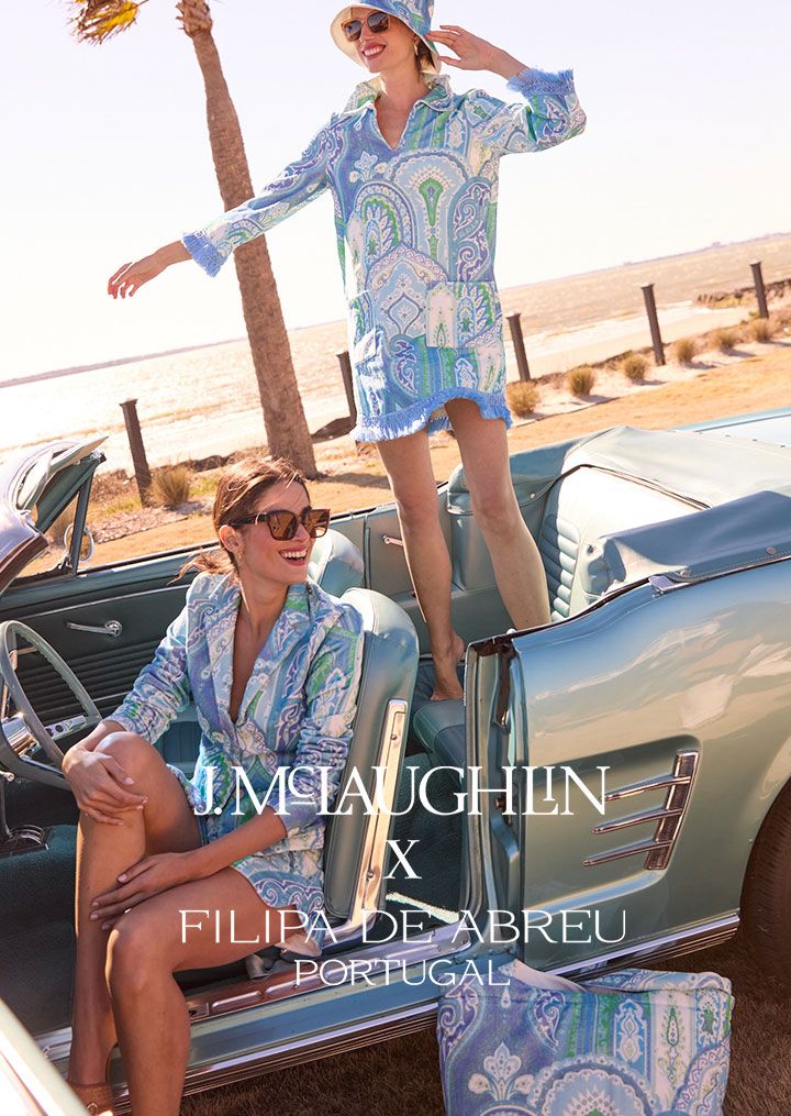 2 models posing with a vintage car wearing the Filipa Collection